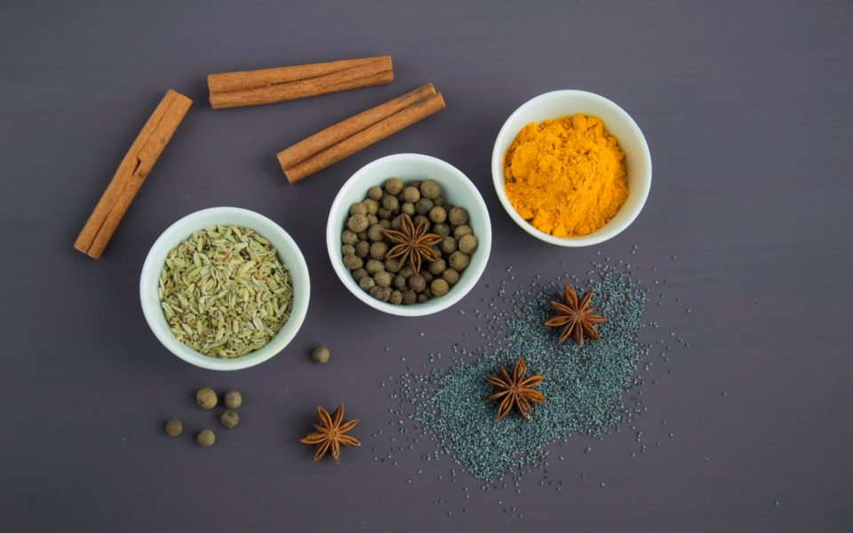Ground spice blends in small bowls, photographed from above